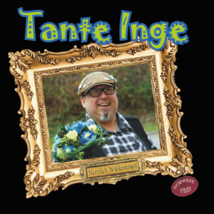 Die CD von Tante Inge heißt "Herzlich Willkommen". Auf dem Cover ist ein junger Mann. Er ist in einem goldenen Rahmen. Er hält einen Blumenstrauß.